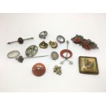A collection of old brooches including silver, agate and coral examples.