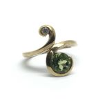 A 9ct gold peridot and diamond ring, approx size J/K