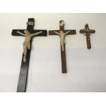 A collection of three Corpus Christi on wooden crosses of varying sizes