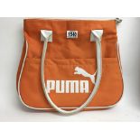 A vintage Puma sports shoulder bag.