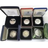 Six cased silver coins.