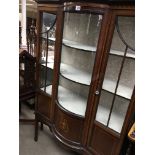 A Edwardian mahogany display cabinet with single drawer on square tapering legs .173 by 110 cm