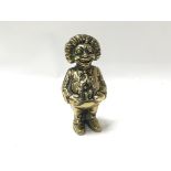 A vintage brass Gollywog money bank, approx 16cm tall