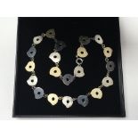 An unusual Arts & Crafts style silver tri-colour necklace