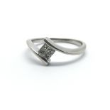 An 18ct white gold and princess cut diamond ring, approx 0.15ct, ring size approx L