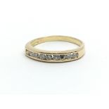 An 18ct yellow gold half eternity ring having a single row of nine diamonds, ring size approx I