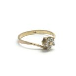 A 9ct gold ring set with a flowerhead pattern of CZ stones, approx 1.4g and approx size N-O.