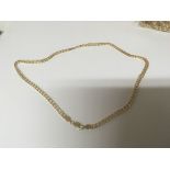 An 18carat gold necklace with a patterned slab sided link stamped Italy 750. Weight 34.5g