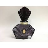 A large Elizabeth Taylor “Passion” perfume display bottle.