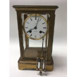 An 8 day French mercury four glass pendulum clock, with white enamel dial and Roman numerals,