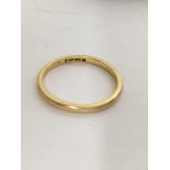 A 22 ct gold wedding band 3 grams a 18 ct gold ring inset with five diamonds and one other ring .