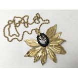 A large Dolce Vita flower pendant with chain