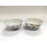 Two small Oriental bowls, both with floral decoration, largest approx diameter 12cm, damaged.