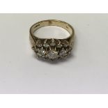 A 9 ct gold ring inset with with a cluster of diamonds size j