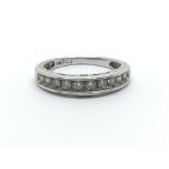 A 14ct white gold ring having a row of ten diamonds, approx 0.33ct, ring size approx J