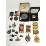 A collection of mainly Masonic related medals plus silver and enamel badges.