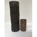 Two Chinese Carved bamboo brush pots depicting figures at leisure, 34 cm and 14 cm .