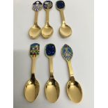 A collection of six gilt and enamel Michelsen Royal Copenhagen spoons marked sterling.