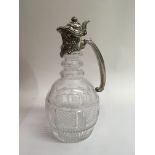 A Tiffany cut glass claret jug with sterling mounts and handle 25 cm .