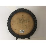 A carved wood Chinese circular shaped table top mirror or picture frame