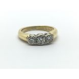 An 18ct yellow gold and three stone diamond ring, approx 0.40ct, ring size approx F/G