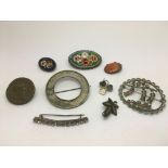 A collection of antique brooches including a micromosaic example.