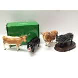 Four Beswick farm animals consisting of two pigs and two cows