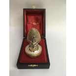 A Stuart Devlin silver gilt limited edition egg Th