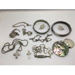 A collection of various silver jewellery items.