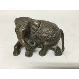 A silver model of a elephant marked 900. 12 cm.