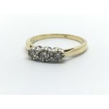 An 18ct yellow gold and three stone diamond ring, approx 0.25ct, ring size approx K