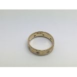 A gold ring set with diamond chips, assay marks indistinct, approx 2.9g and approx size O.