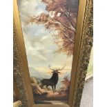 A pair of gilt framed oils on canvas depicting stags in country side views . 35 cm by 100 cm .