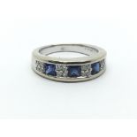 An 18ct white gold, diamond and sapphire ring, diamonds approx 0.23ct, ring size approx L/M