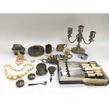 A collection of oddments including silver plated items, carved ivory figures etc.