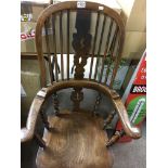 An elm stick back chair with solid seat on turned legs together with a mahogany occasional table the