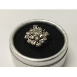 A Art Deco style cocktail ring inset with diamonds 5 ct approx. Size M . One stone missing.