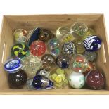 A collection of glass paperweights.