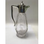 A cut glass claret jug with silver mounts Birmingham hallmarks 1907. 22 cm.