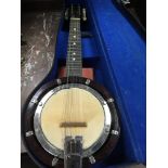 A cased ukulele banjo.