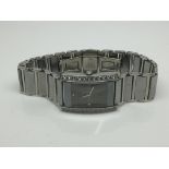 A gents Tungsten watch with a black face and set with CZ stones - NO RESERVE