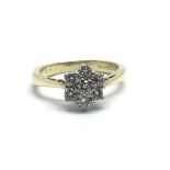 An 18ct yellow gold and seven stone diamond cluster ring, approx 0.25ct, ring size approx E