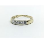 A 9ct yellow gold and CZ five stone ring,size approx L/M