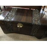 A Quality carved camphor wood Oriental trunk the top and front with two folate carved panels