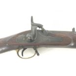 An Enfield Percussion Rifle with a brass trigger guard the action stamped with crown.