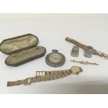 A white metal cased watch cased studs silver gilt Rotary watch two silver thimbles and a brooch