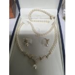 An 18carat gold and small diamond set pearl jewellery cultured freshwater pearls Made by Mikura