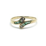 A 14ct yellow gold emerald and diamond ring, size approx N/O
