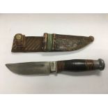 A vintage British hunting knife and sheath.