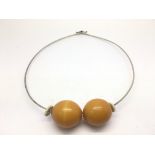 A modernist silver and amber necklace.